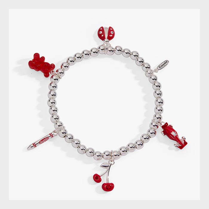 Crayola Charm Stretch Bracelet. silver bracelet with scarlet charms.